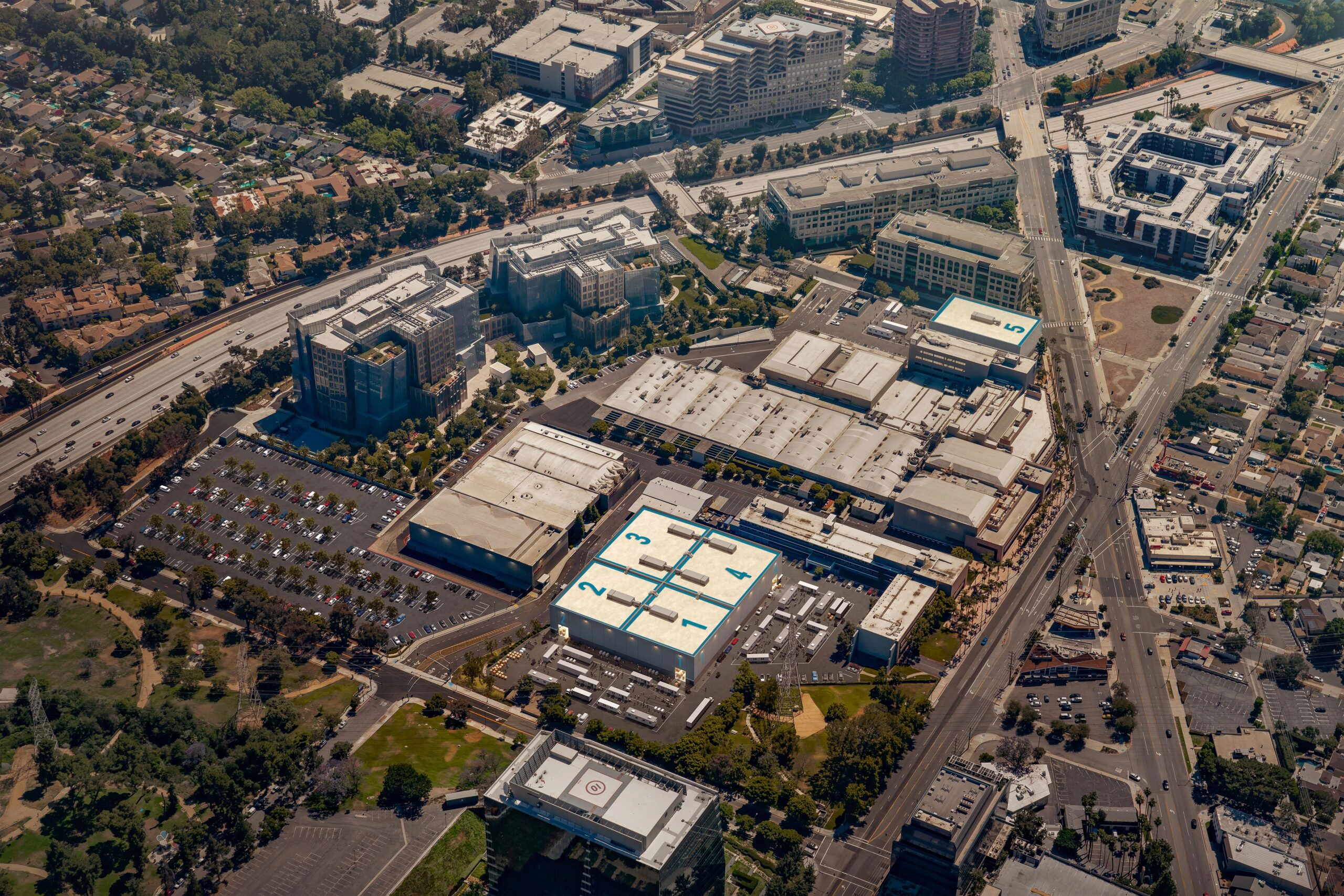 An aerial view of an urban area with multiple buildings and roads.