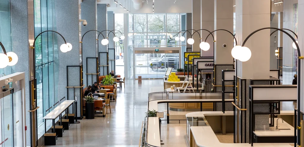 A brightly lit modern lobby of a building.