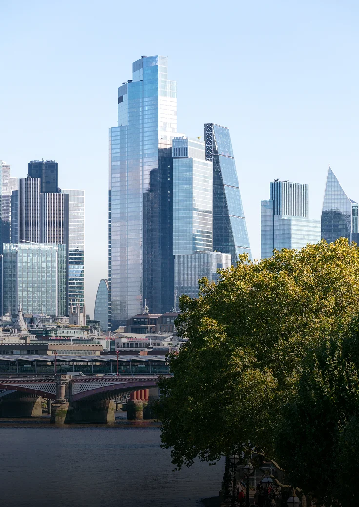 Glass skyscrapers clustered in a city skyline.