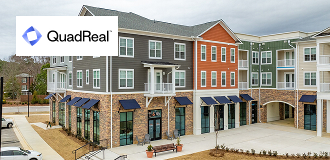 A modern apartment complex with various facades featuring brick and paneling.