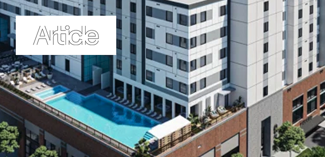 A modern high-rise building with a rooftop pool and lounge area.