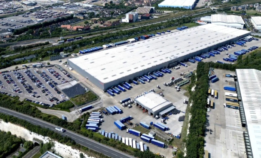 An aerial view of an urban area with multiple buildings and roads.