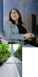 1. A business person laughing and holding a microphone and papers while seated.
2. A paved walkway next to a leafy green park.