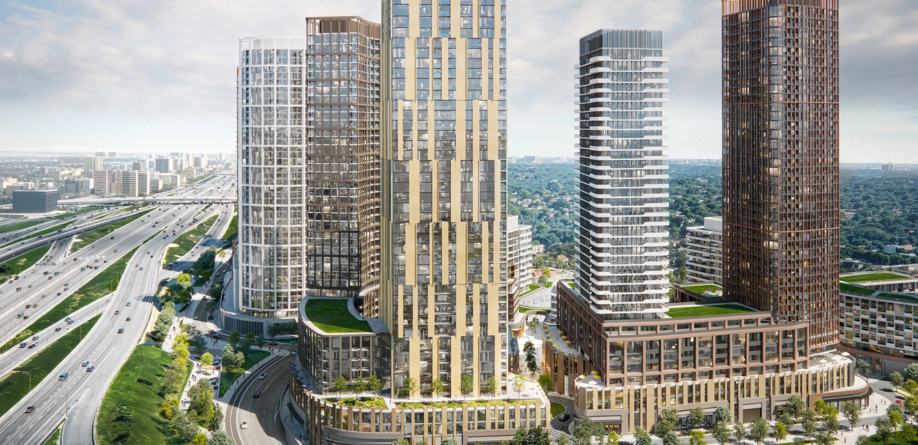 An aerial view of a modern high rise neighbourhood close to highways.