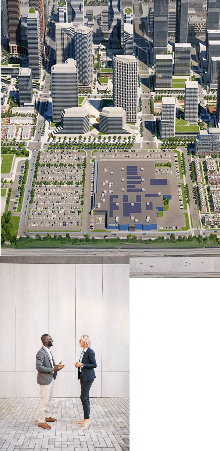 1. An aerial view of a cityscape featuring numerous skyscrapers and modern buildings. In the foreground, there is a large parking area and a few low-rise structures. The city is surrounded by greenery. 2. Two people in business attire talking outside on paved path next to a building. 