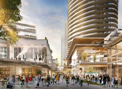 A bustling urban shopping area with numerous people walking and exploring. The scene features modern high-rise buildings and vibrant architecture under a clear sky.