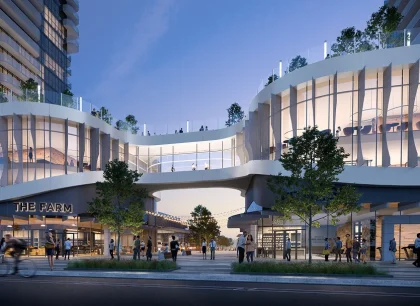 A modern urban scene featuring a connected architectural structure with illuminated walkways. The setting is at dusk, and there are trees and people on the street below.