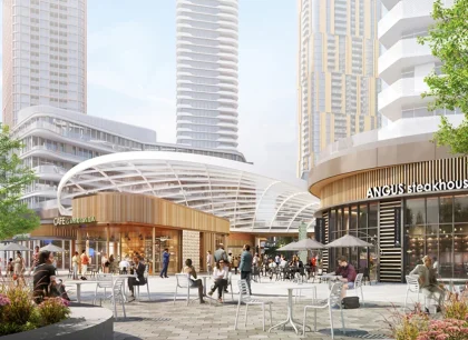 A vibrant urban plaza with people walking and shopping, surrounded by modern high-rise buildings. The area has outdoor seating and contemporary architectural elements.