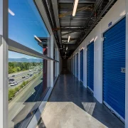 Hallway with blue storage units on the right.