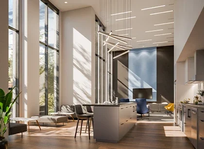 A spacious, modern interior with tall windows allowing natural light to fill the room. It features stylish furniture, a reception desk, and sleek design elements.